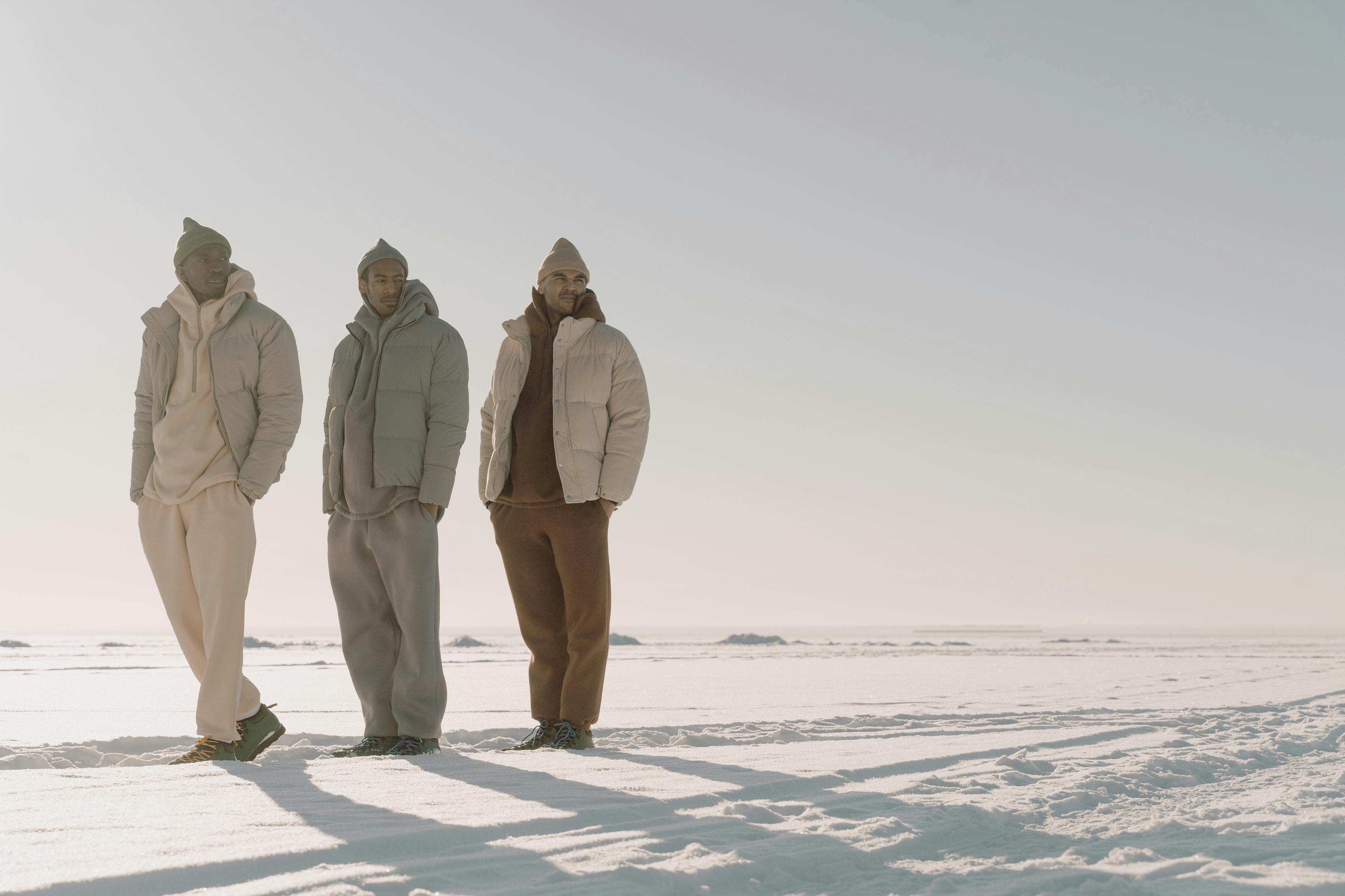 men standing on the snowy field