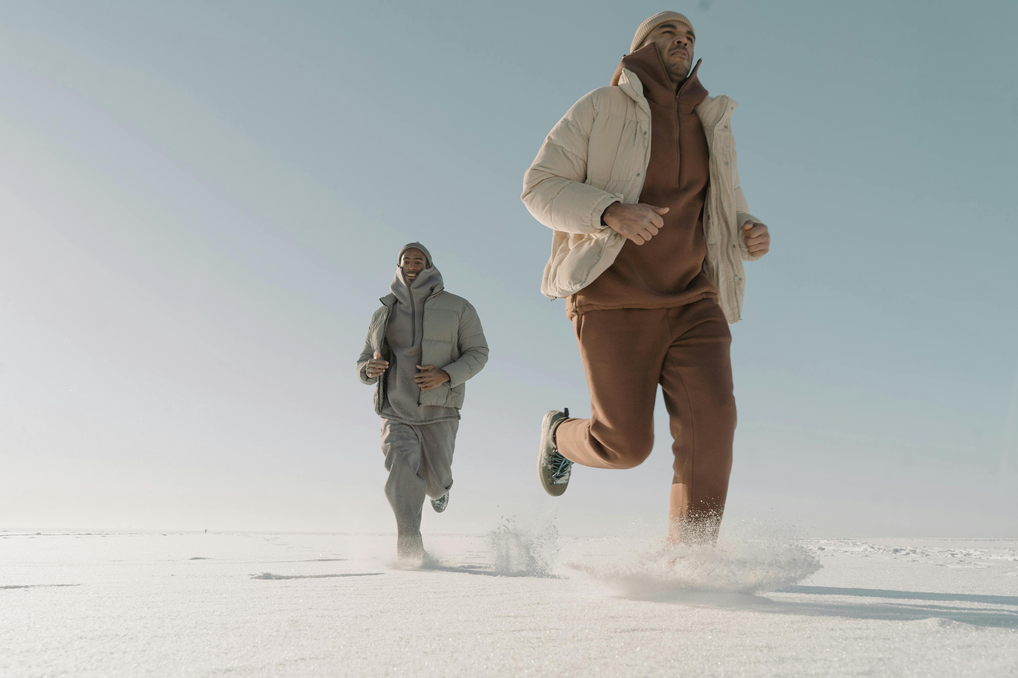 men running on snowy weather